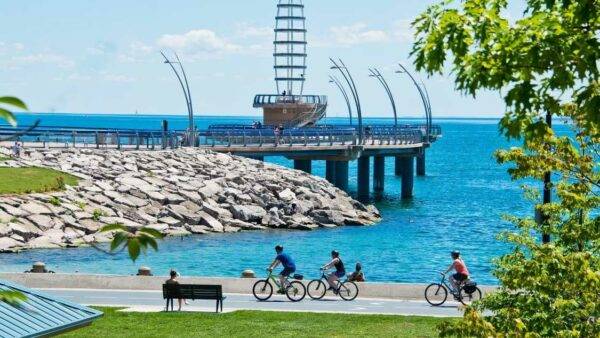 People enjoying the beautiful weather and view of the Burlington Waterfront.