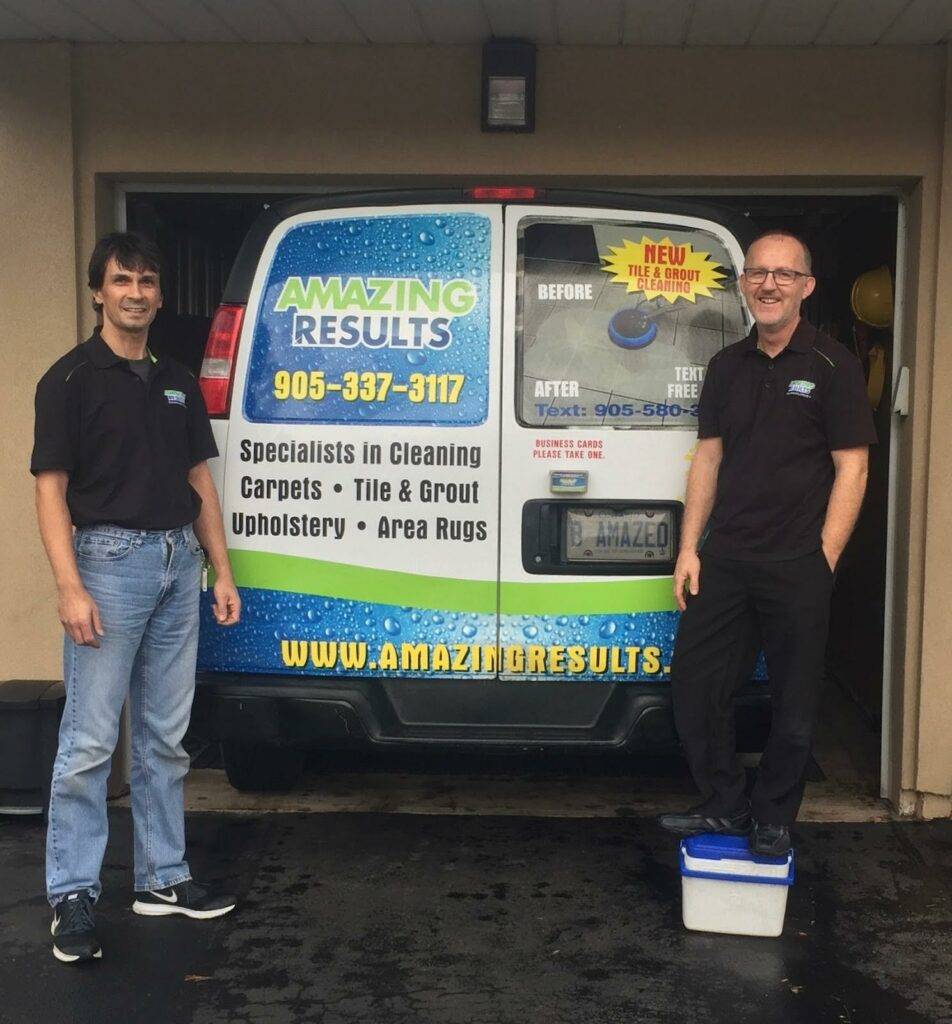 Todd, owner, and Jamie standing at the back of the Amazing Results van ready to service clients in Burlington and Oakville.