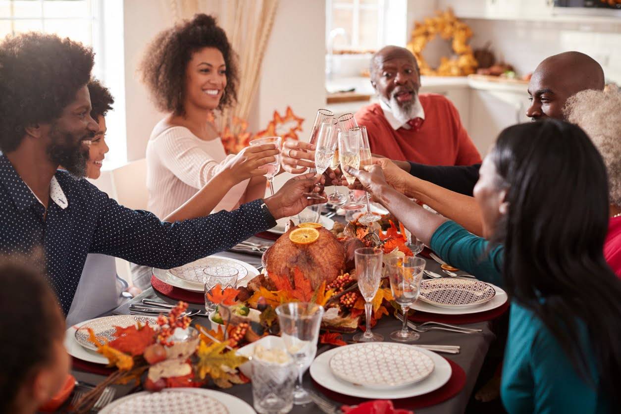 After having her carpets professionally steam-cleaned, the homeowner is hosting her family for Thanksgiving dinner. They make toast over the turkey.